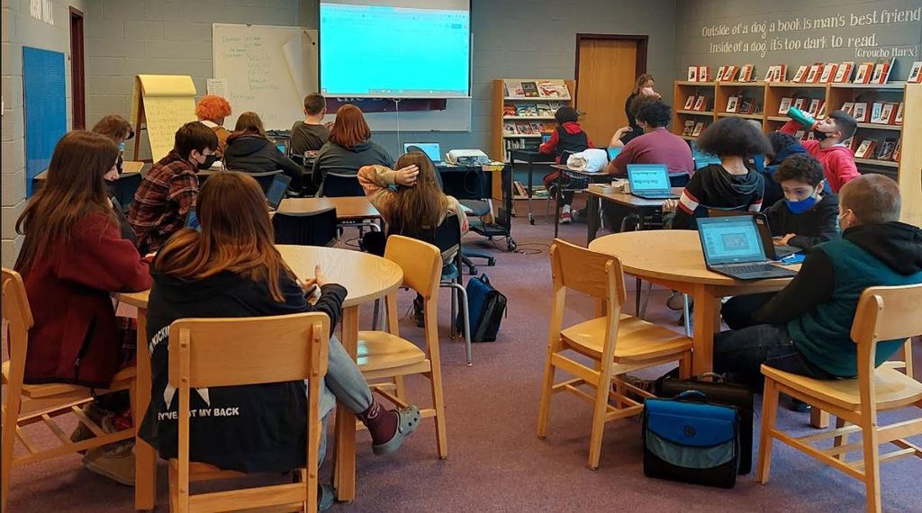 Gloversville Middle School, eighth-grade students created and presented '"Pay It Forward" research proposals in the library. Students researched local organizations and interviewed volunteers for the project. The students utilized research skills, learned more about their community, and how they can help others.