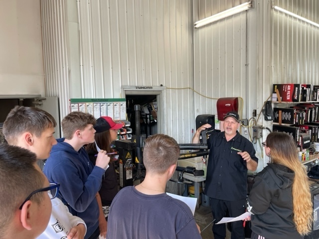 I just wanted to forward some pictures of our first Micro Field Trip with our Auto Tech class visiting the ADK Express Lube. We were really fortunate that the owner Mr. Hutchins took time out of his day to give us a tour of his facility. Our scholars learned that a business such as Mr. Hutchin's is not necessarily about servicing cars, but more about providing quality service to people.  As a result of his business motto and the efficiency of the establishment the Gloversville/Johnstown location services anywhere from 240 - 300 cars a week!! The 20 minutes consisted of an explanation of the roles and responsibilities of each employee, and the operating mechanicals of the establishment. Overall the field trip was a huge success, and we are all looking forward to more in the future. 